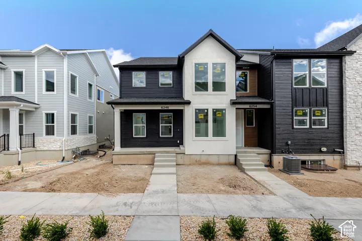 Modern facade featuring contrasting black and white siding