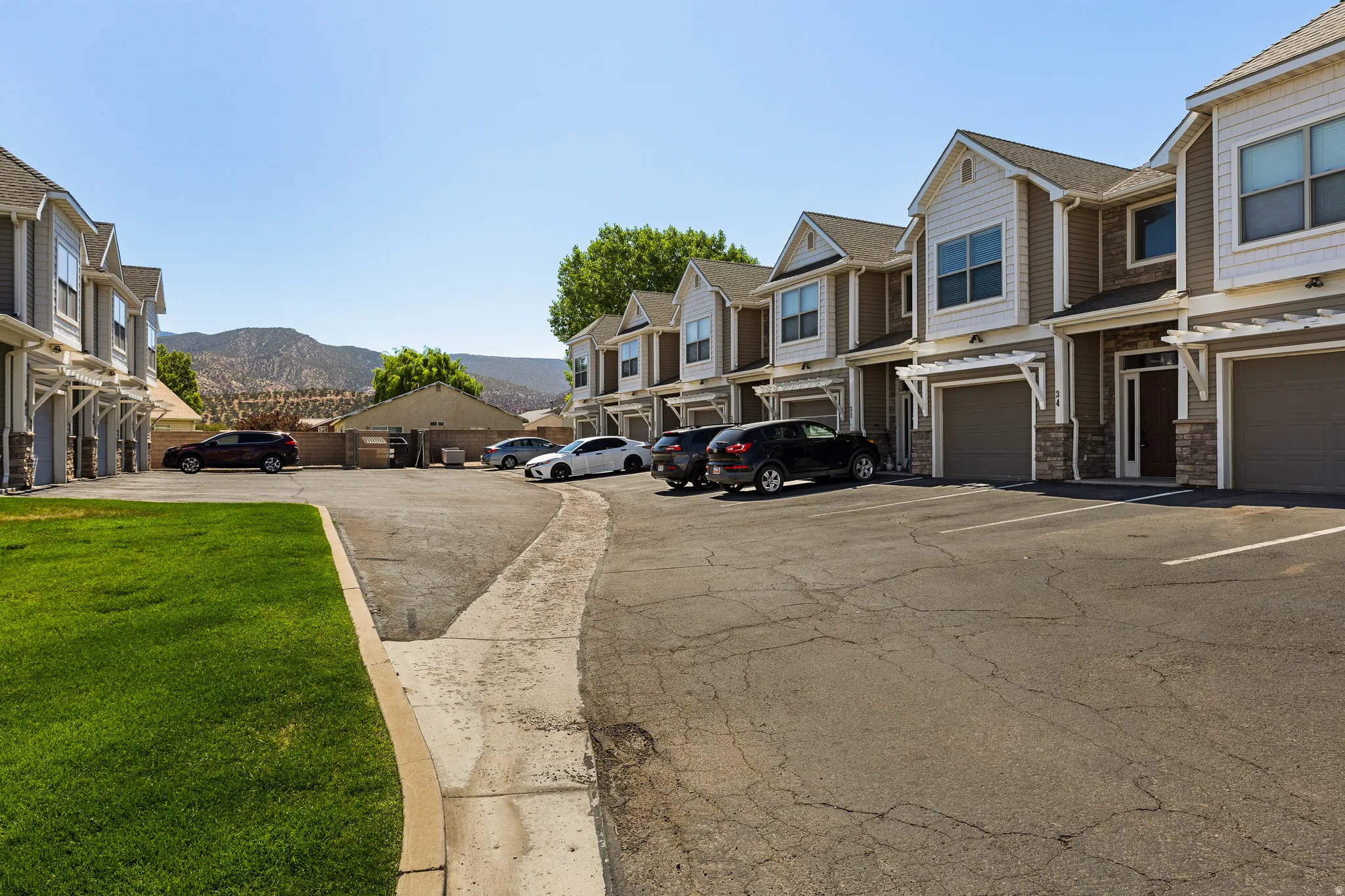 Contemporary townhome-style units featuring attached garages and private entrances