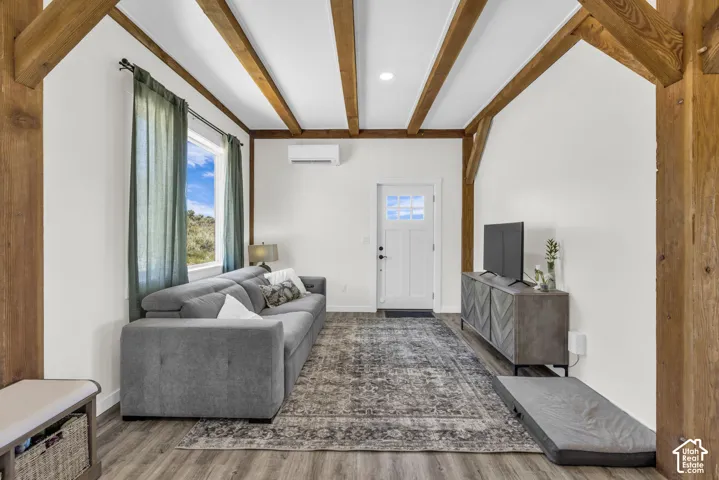 Exposed wood beams and columns highlight this living area