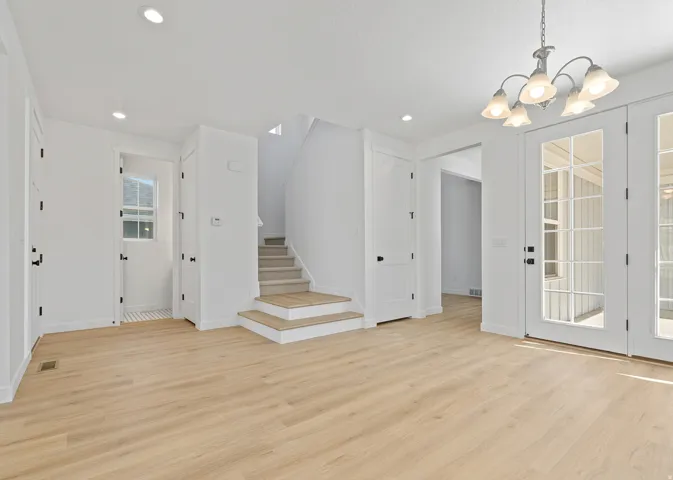 Open concept interior featuring light wood-finish flooring