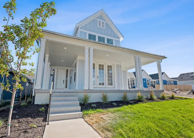 Light blue vertical siding exterior with white trim