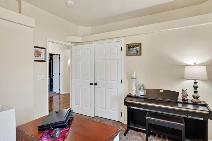 Neutral wall color with layered crown molding and white trim