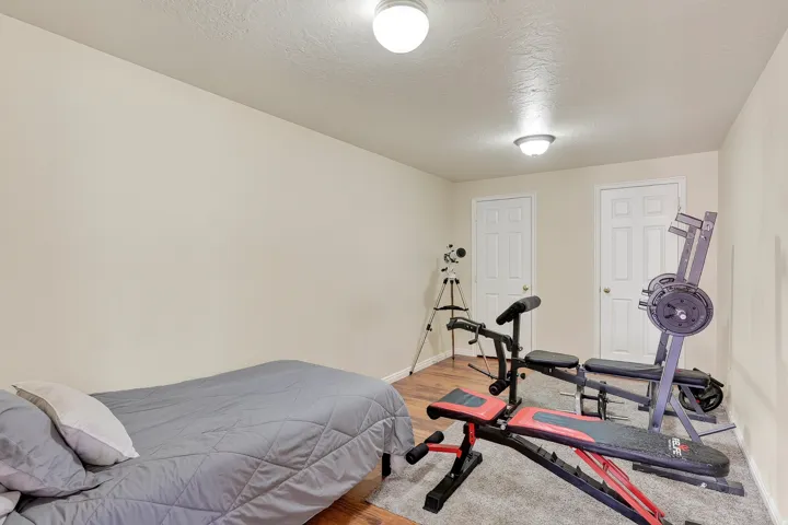 Room featuring two white paneled doors, recessed lighting, and a neutral wall color