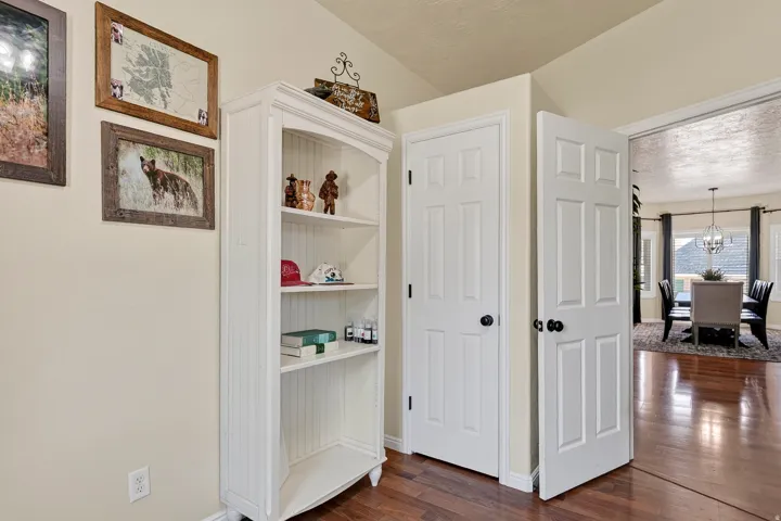Built-in white shelving unit with beadboard backing