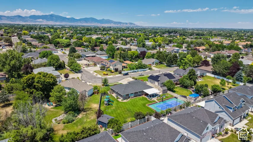 Aerial overview showcasing a residential neighborhood with a mountain backdrop
