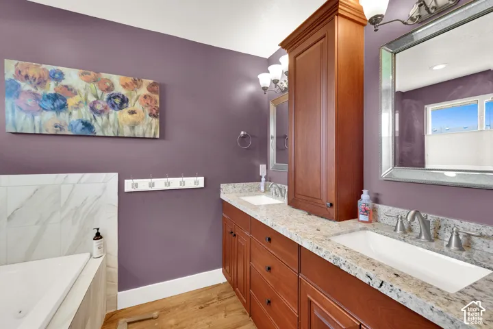 Double vanity with granite-style countertops and integrated sinks