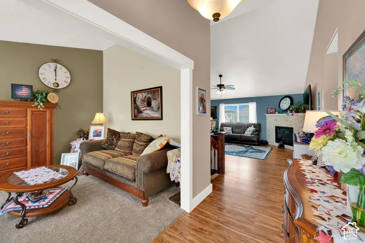 Vaulted ceilings and wood-finish flooring create an open atmosphere