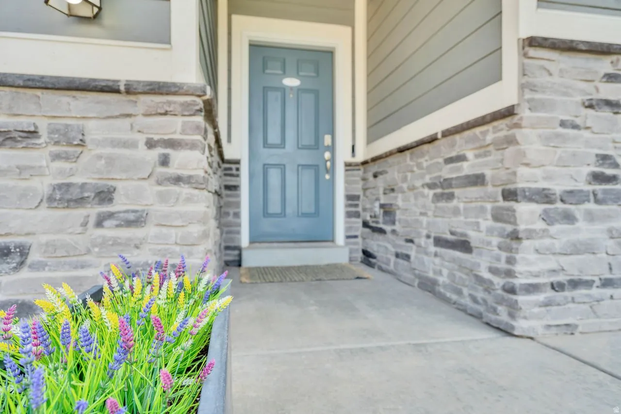 Stone veneer facade with light blue entry door