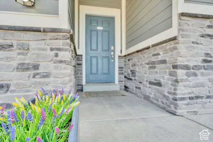 Stone veneer facade with light blue entry door