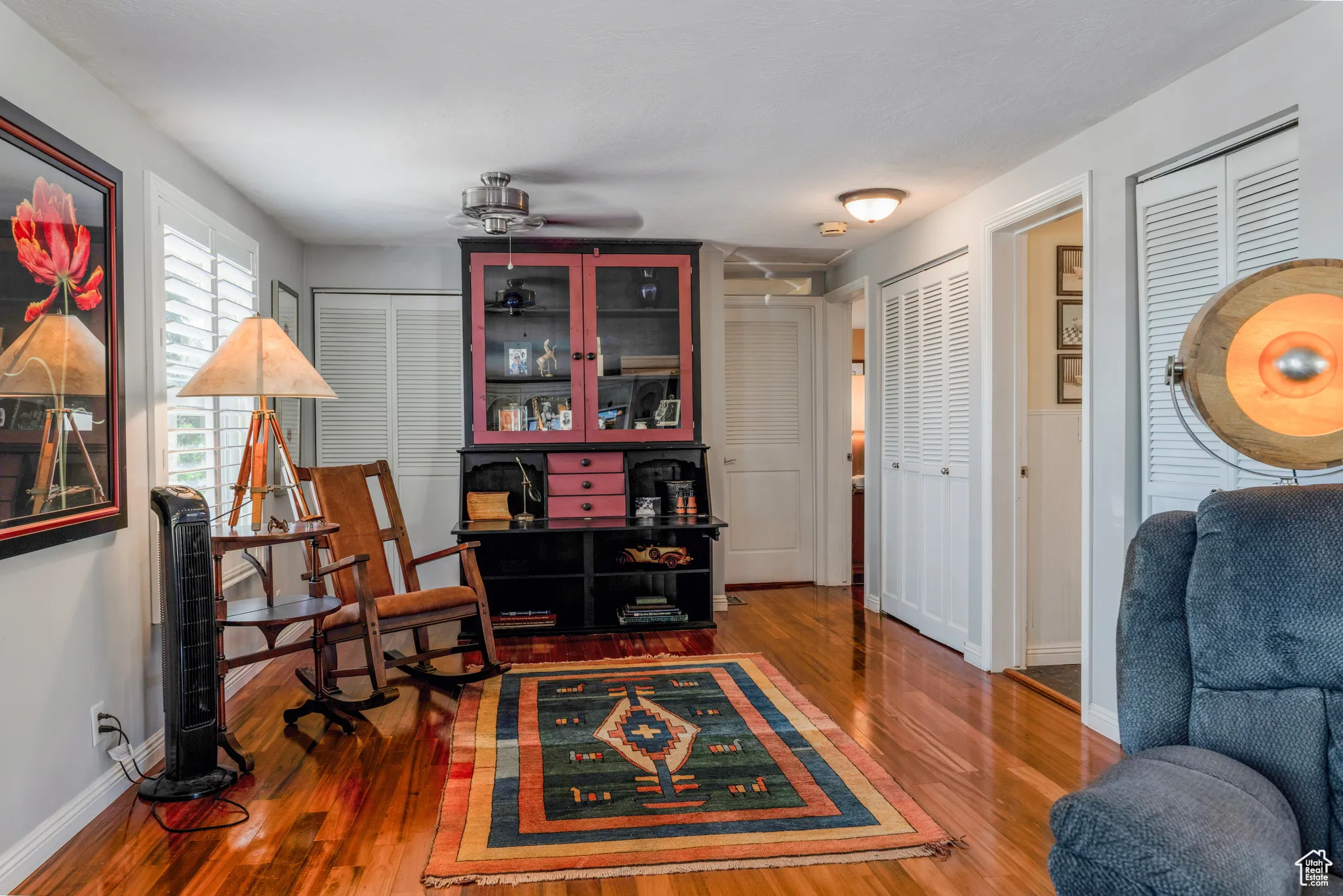 Warm wood-finish flooring extends through the space