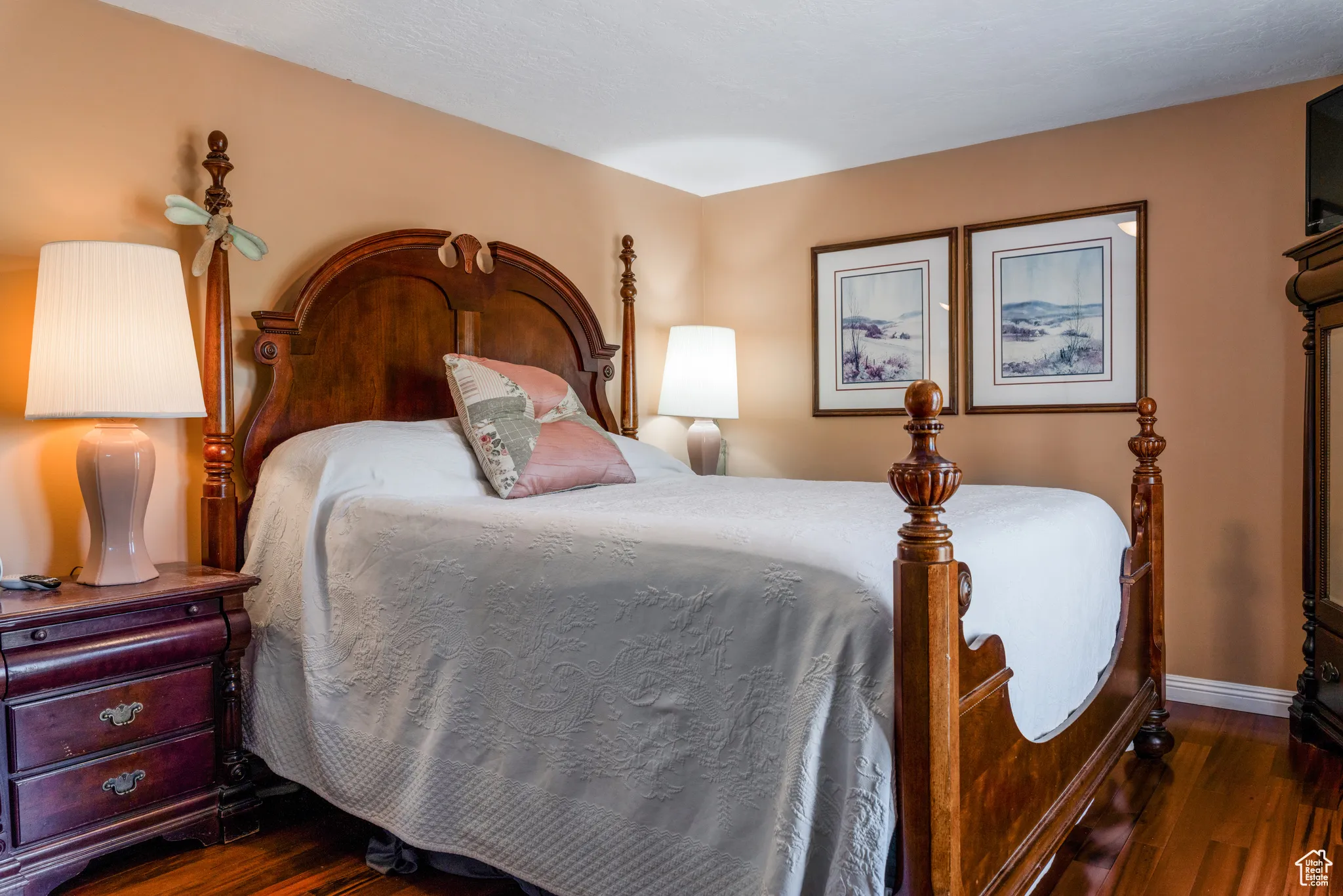Hardwood flooring, warm wall tones, and recessed lighting