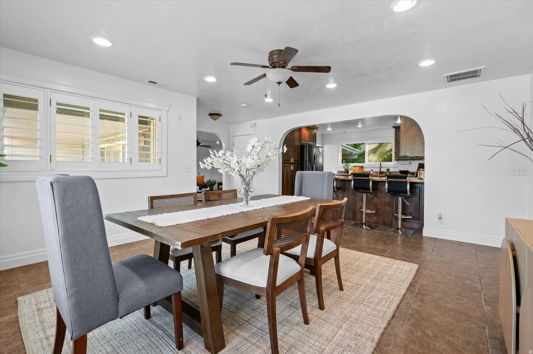 Dining area featuring recessed lighting, a ceiling fan, and wood-finish flooring