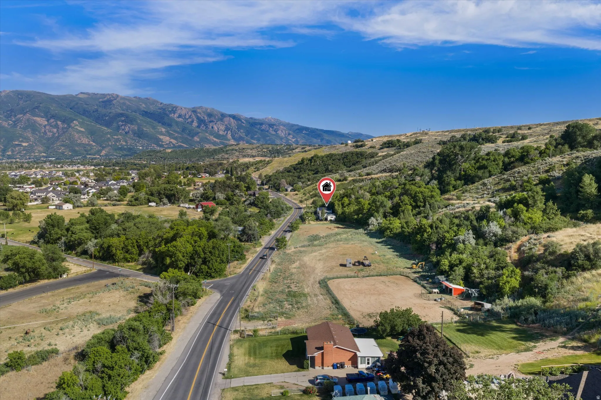 Aerial perspective showcasing expansive natural surroundings with distant mountainous terrain