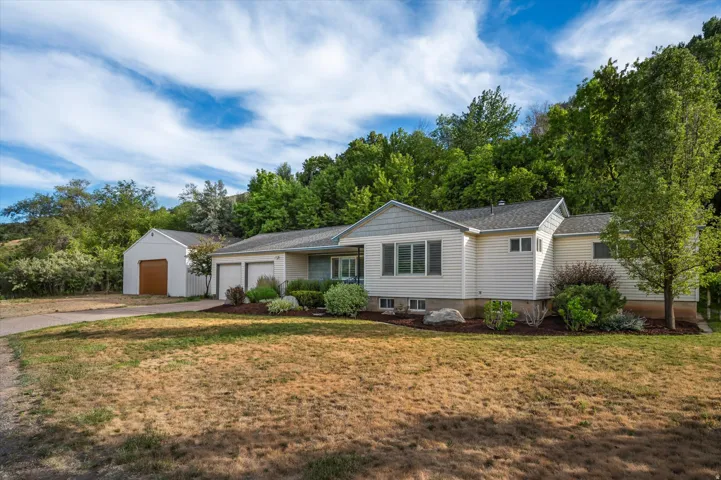 Single-story residence featuring an attached, 2-car garage and a detached, 30x30 workshop.
