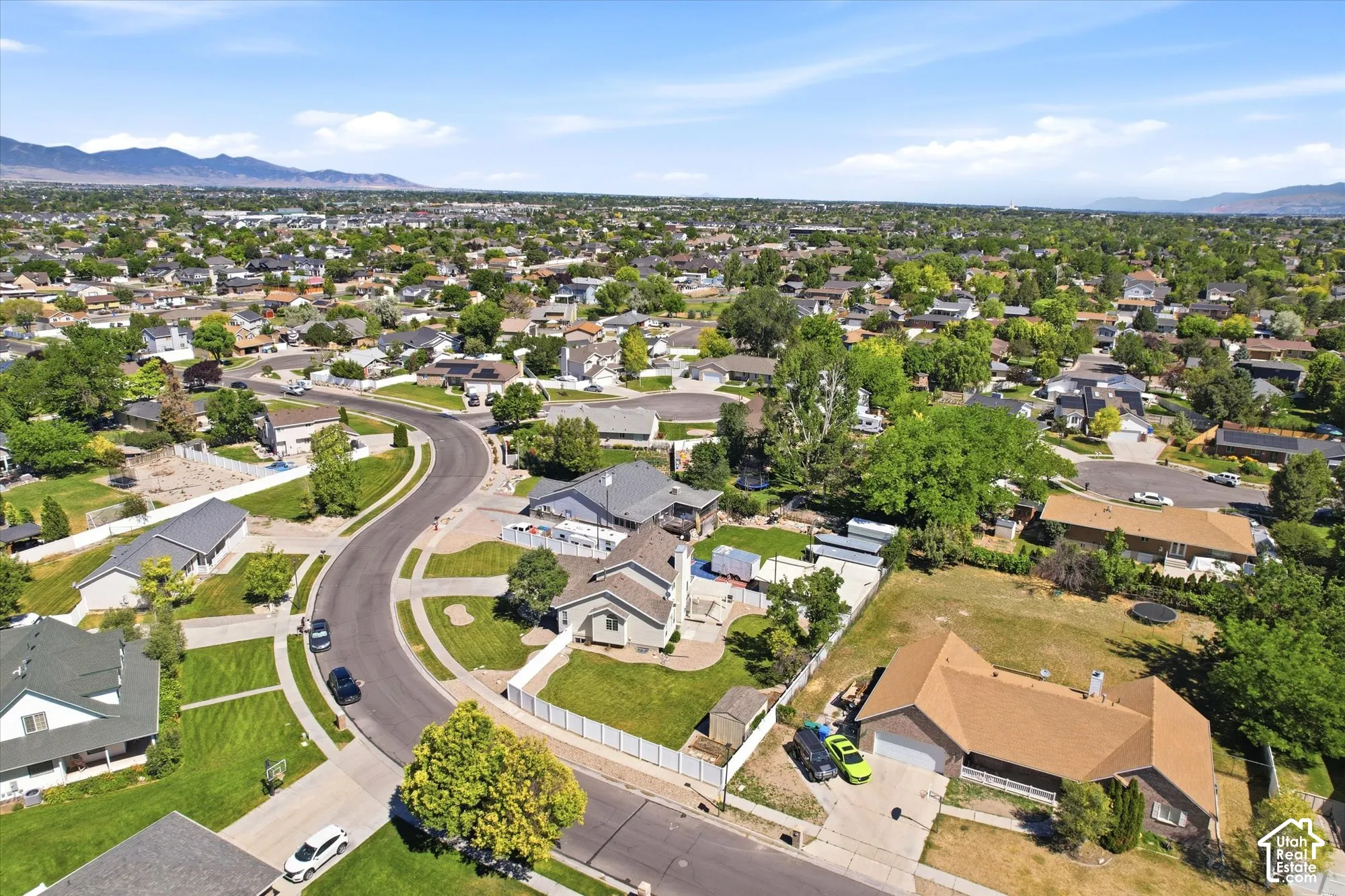 Expansive residential neighborhood featuring numerous single-story homes with varied rooflines and extensive green landscaping
