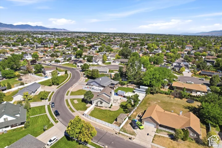 Expansive residential neighborhood featuring numerous single-story homes with varied rooflines and extensive green landscaping
