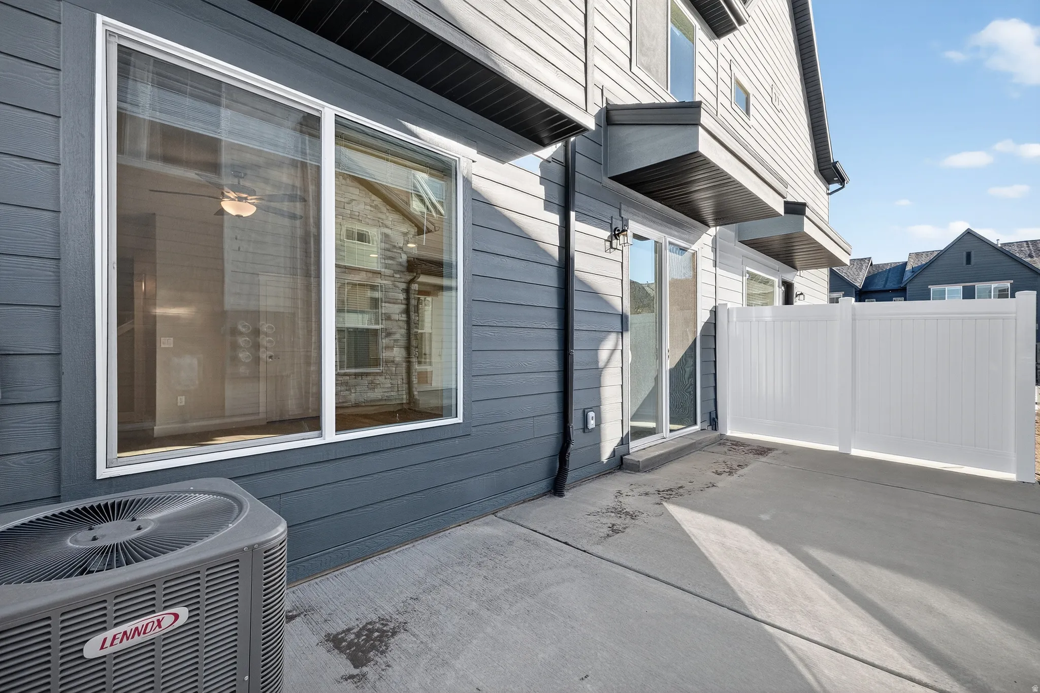 Concrete patio with a privacy fence