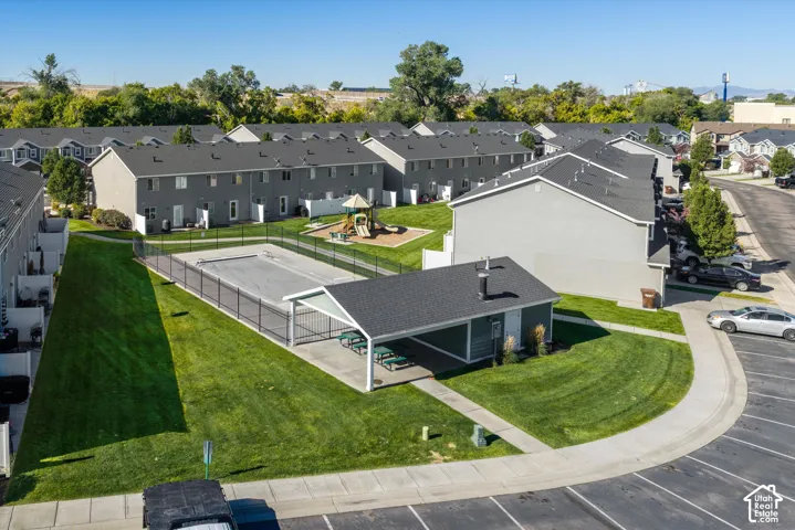 Community features include a fenced swimming pool, shaded picnic area, and a children's play structure