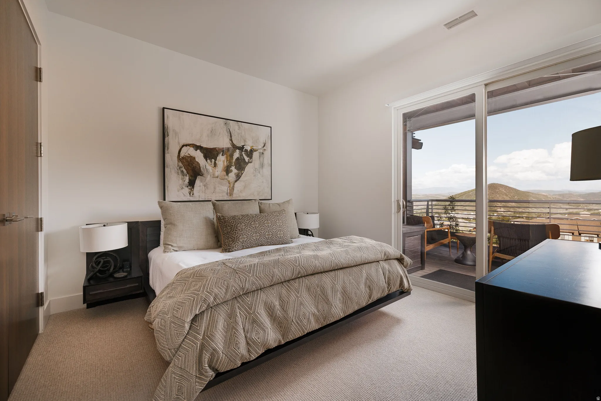 Wall-to-wall carpeting and neutral wall tones create a serene atmosphere