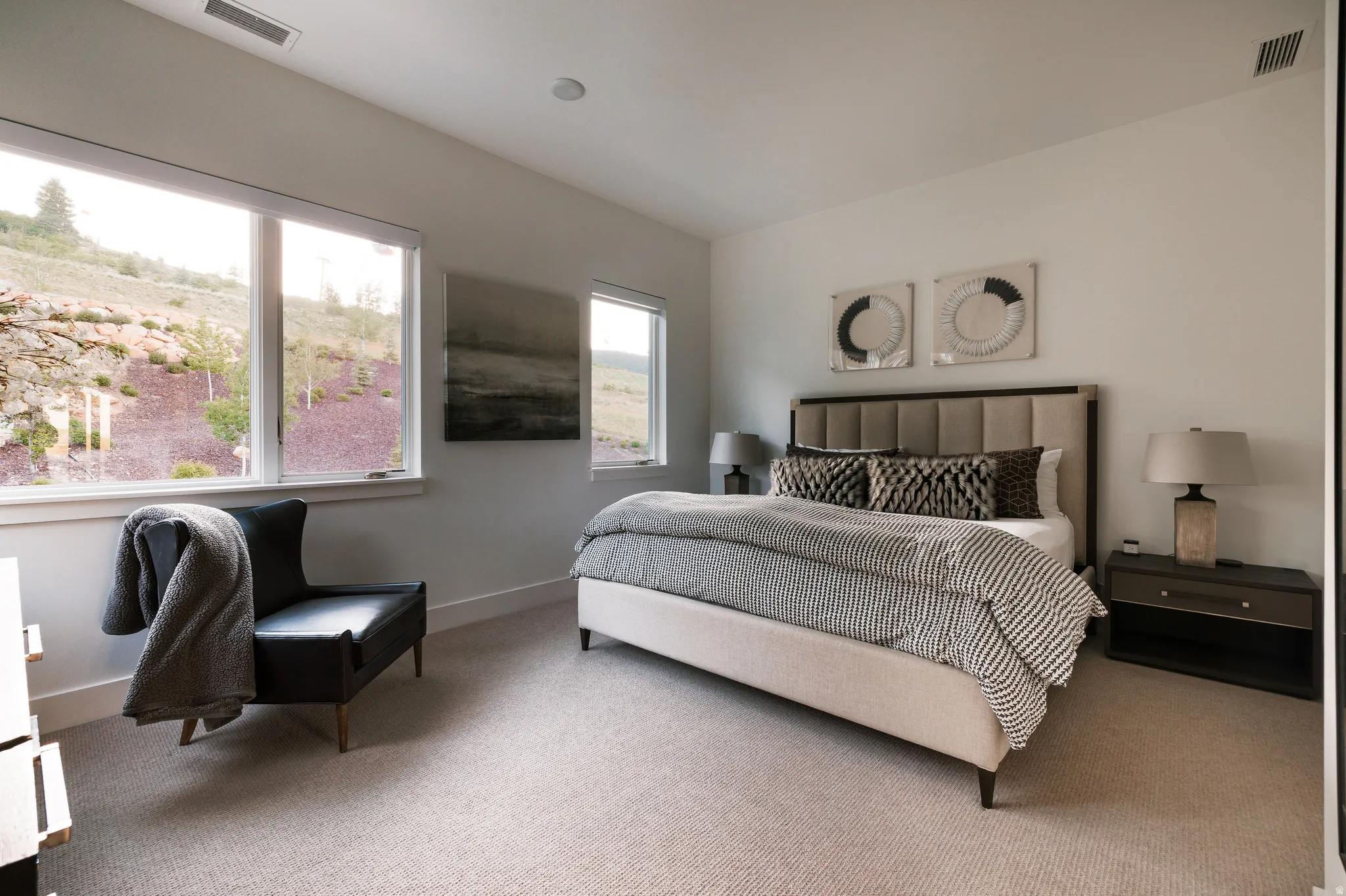 Spacious interior with neutral carpeting and light-toned walls