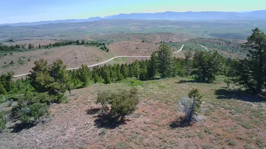 Expansive natural landscape with varied terrain and distant mountains