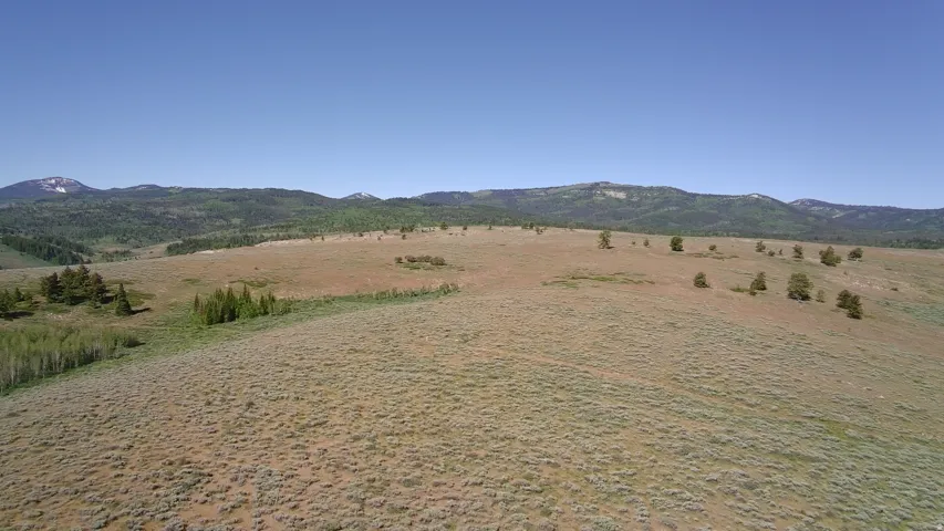 Expansive open land featuring varied topography