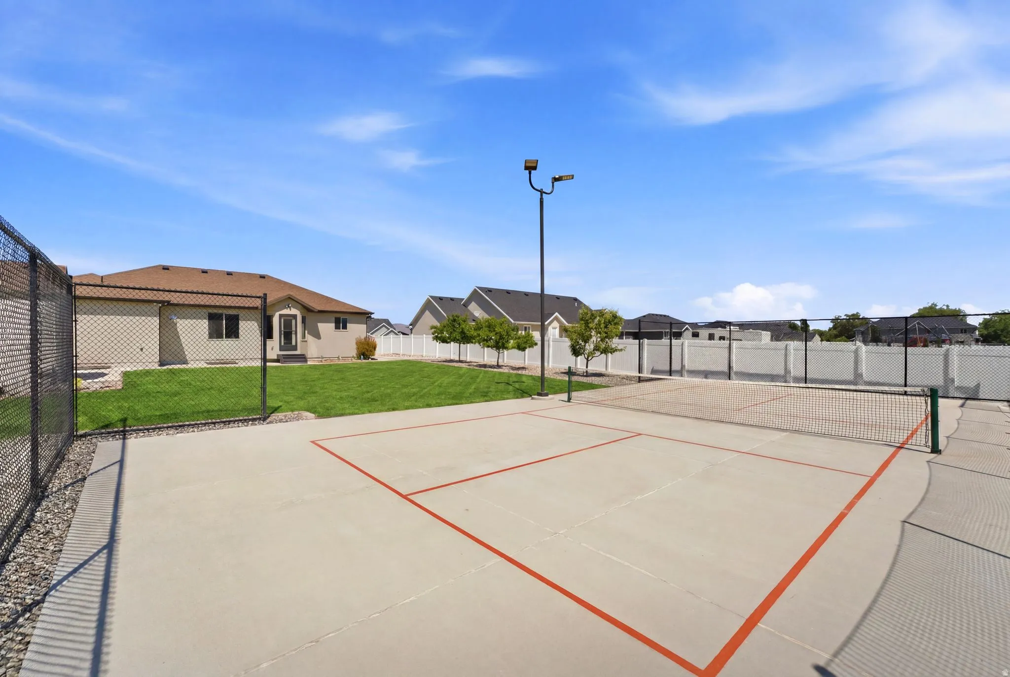 Outdoor sports court with painted lines and net