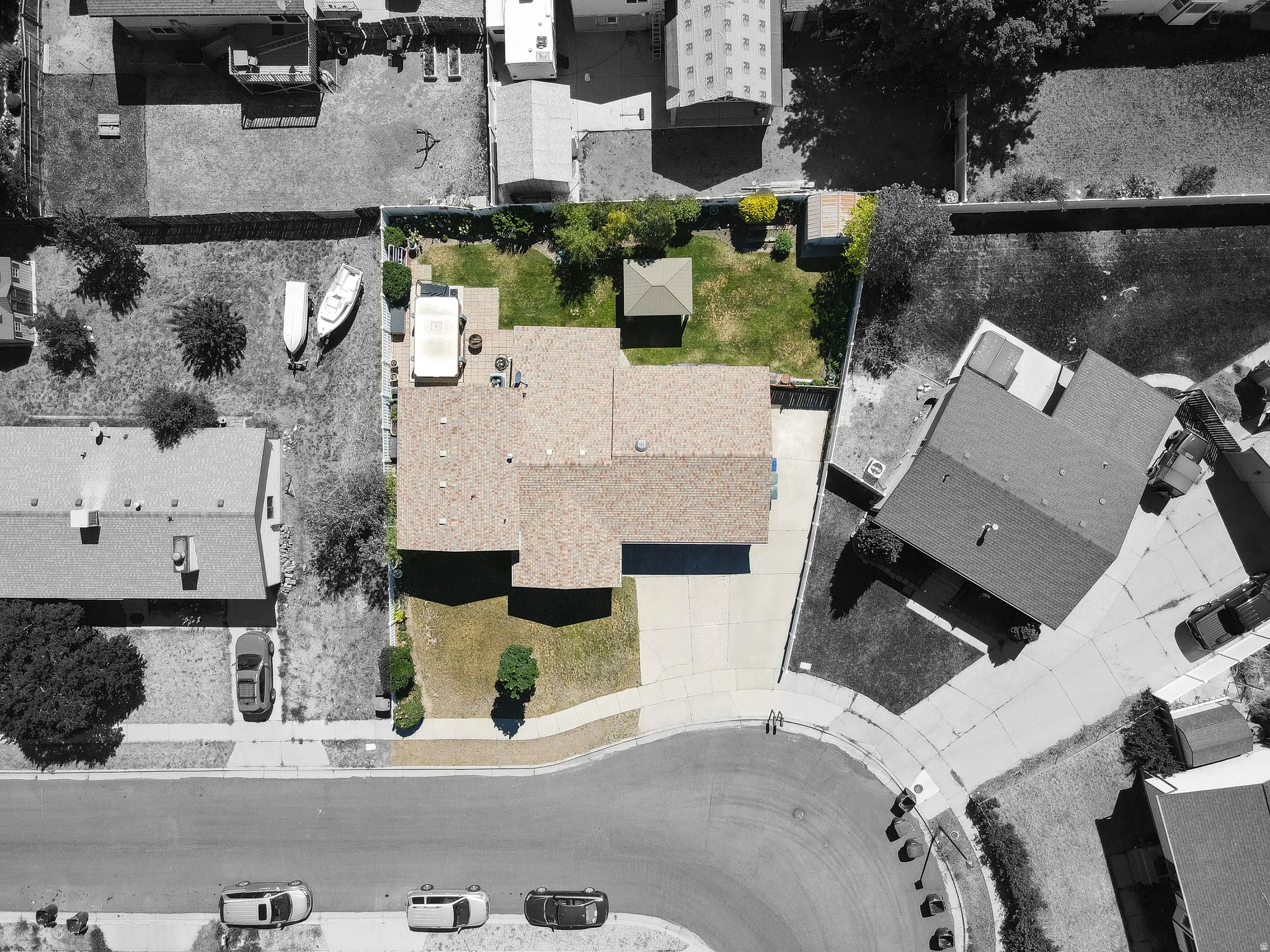 Residential property featuring a shingle roof and an attached garage