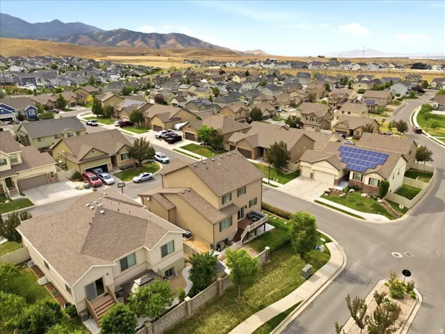 Expansive residential community featuring a variety of detached homes with pitched shingle roofs and integrated garages