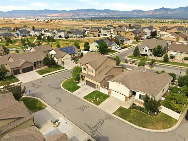 Aerial view of a residential neighborhood with mountain scenery