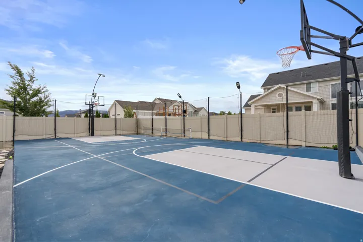 Multi-sport court featuring dedicated basketball and tennis areas.
