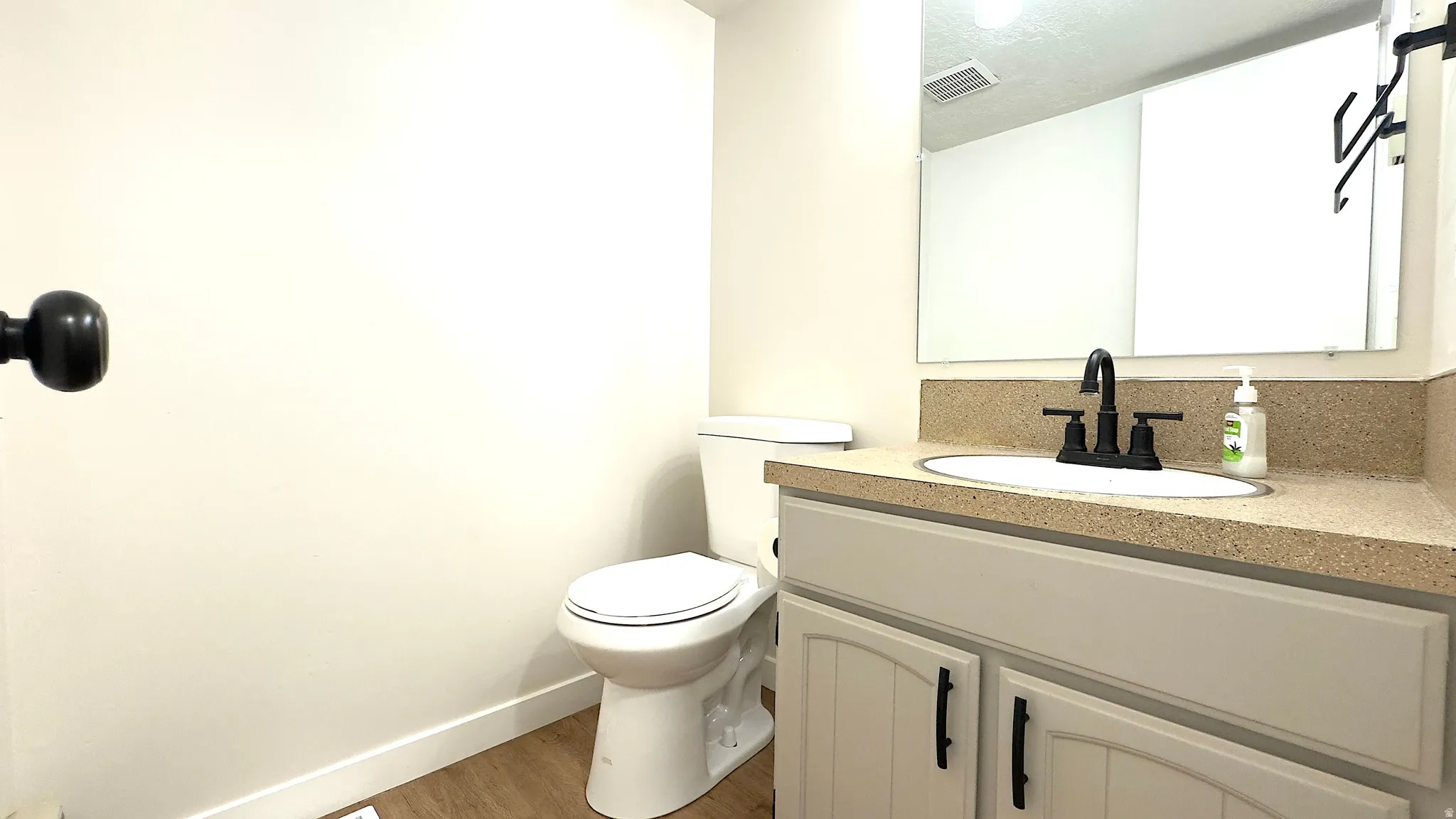 Main level 1/2 bathroom just off the kitchen/living room area.