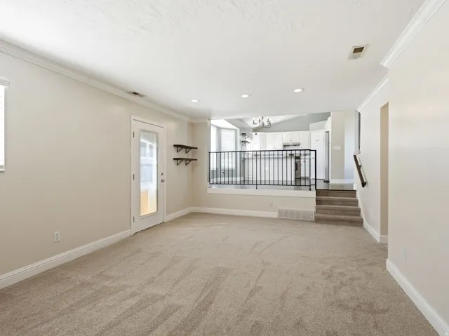 Family room off kitchen with new carpet-walks out to back yard