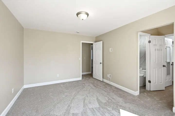 Primary bedroom showing walk-in en-suite