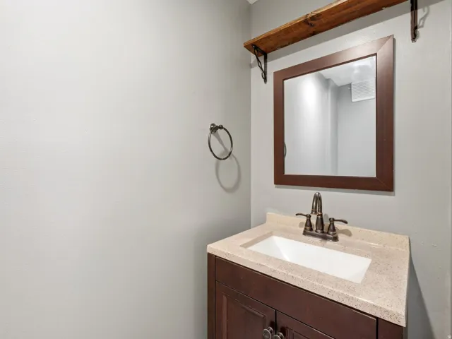 Guest bathroom off family room/laundry area
