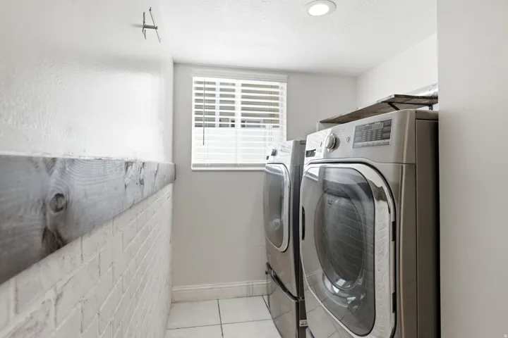 Dedicated laundry room includes washer and dryer