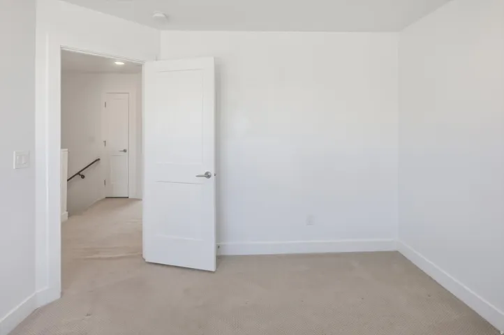 Neutral wall colors with light-toned carpeting and white trim