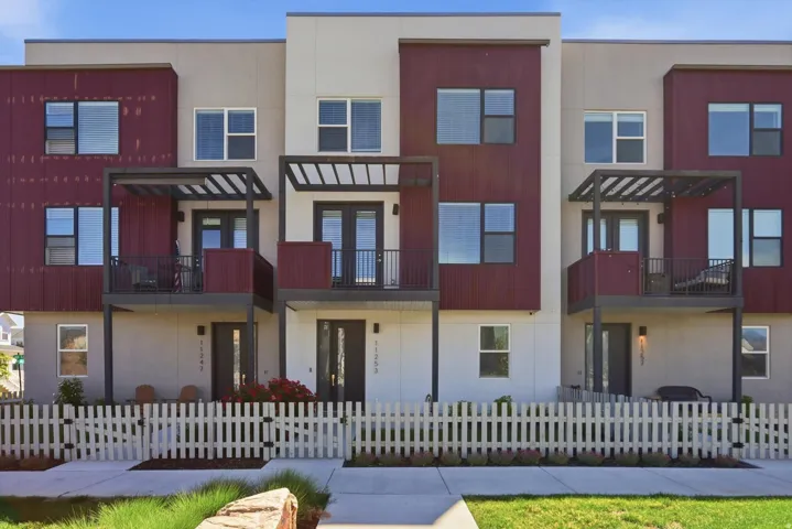 Modern multi-level townhome exterior featuring contemporary architectural design