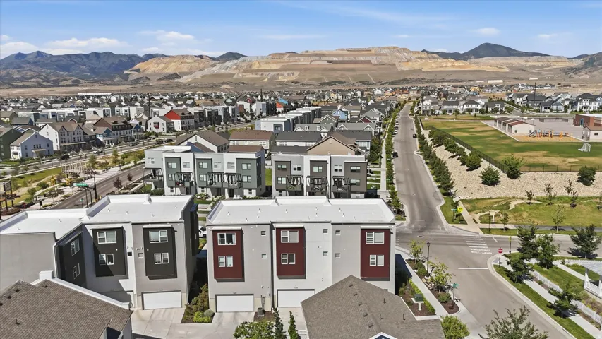 Modern multi-story residential buildings featuring clean lines and contrasting facade elements