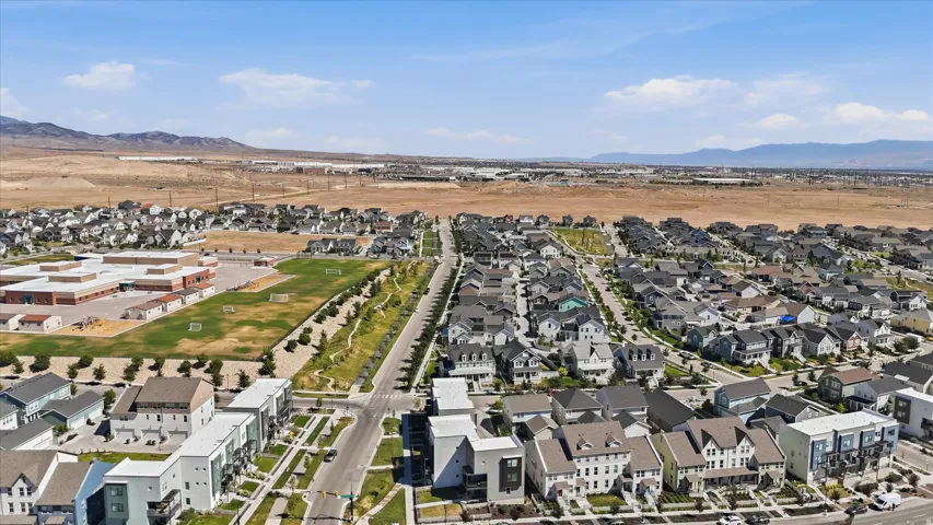 Expansive aerial perspective showcasing a residential development with diverse architectural styles