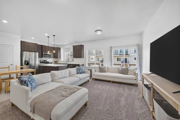 Open concept living area featuring recessed lighting