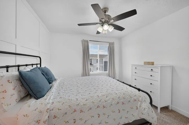 White interior walls featuring a decorative board and batten accent wall