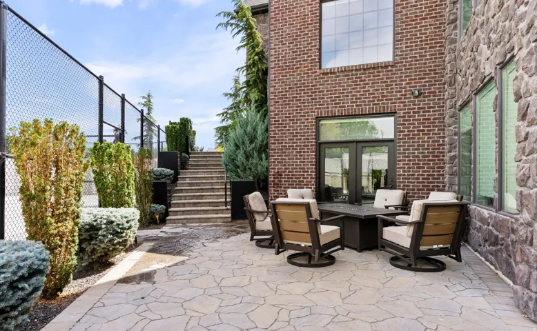 Expansive stone patio with irregular flagstone paving