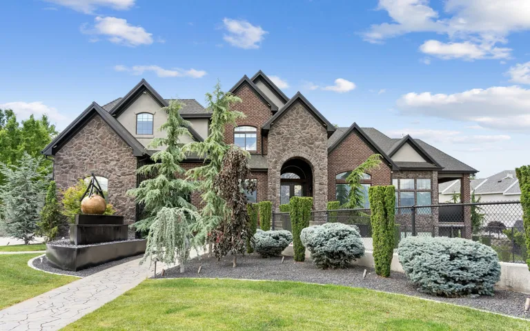 Stone and brick exterior with multiple gables and varied rooflines