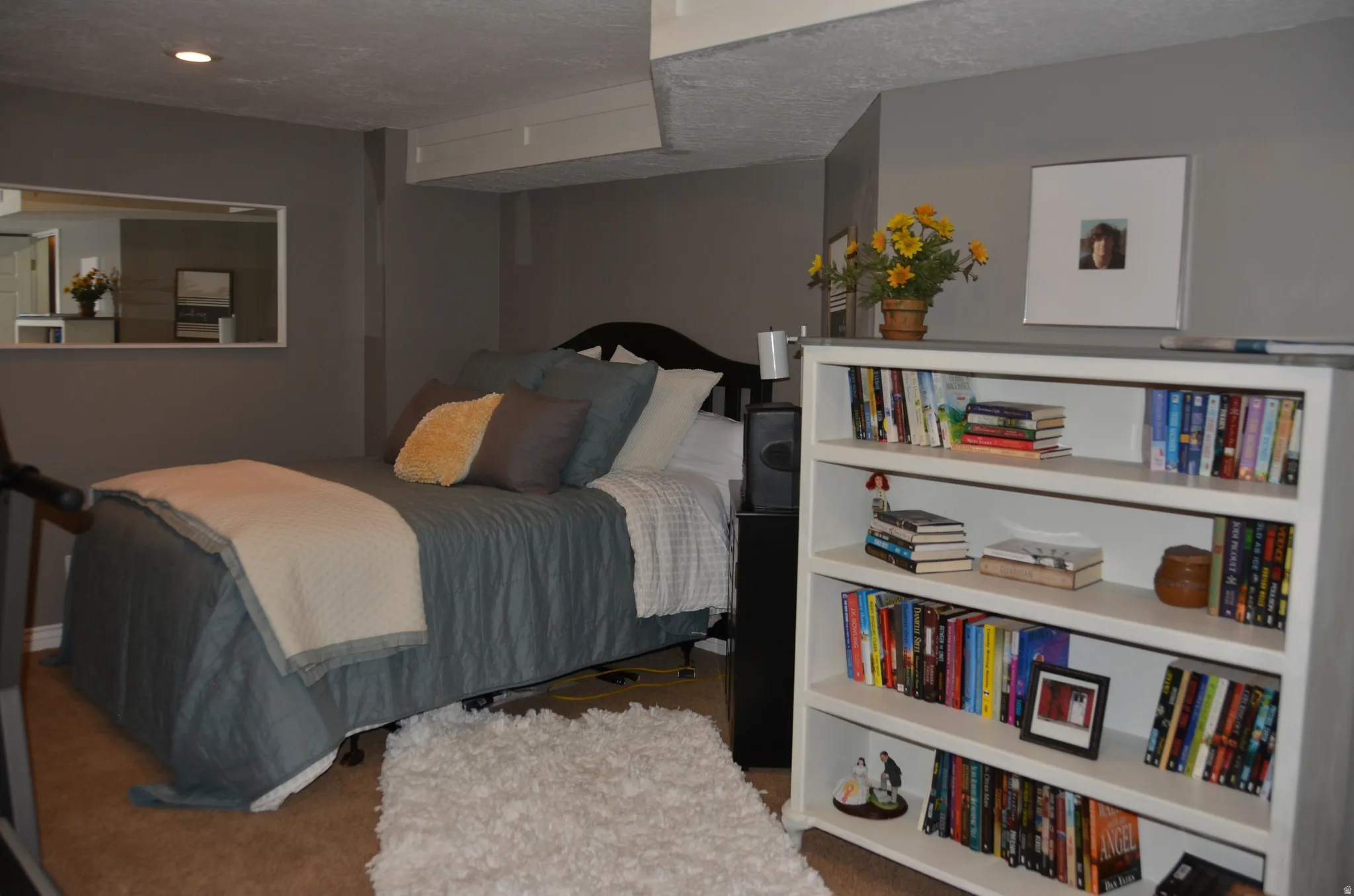 Carpeted room can be used as an exercise room or a guest room.