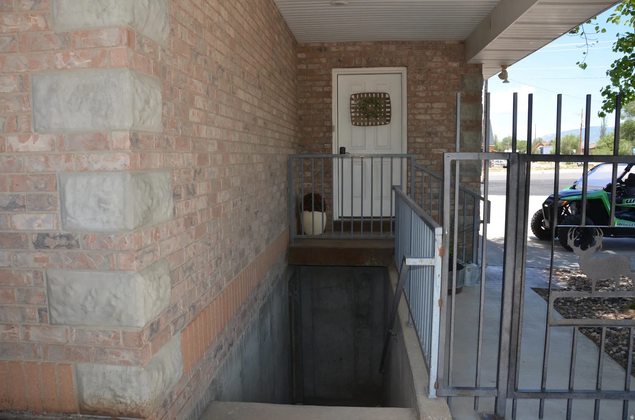 Walk out basement, Brick exterior with stone accents and a covered entryway