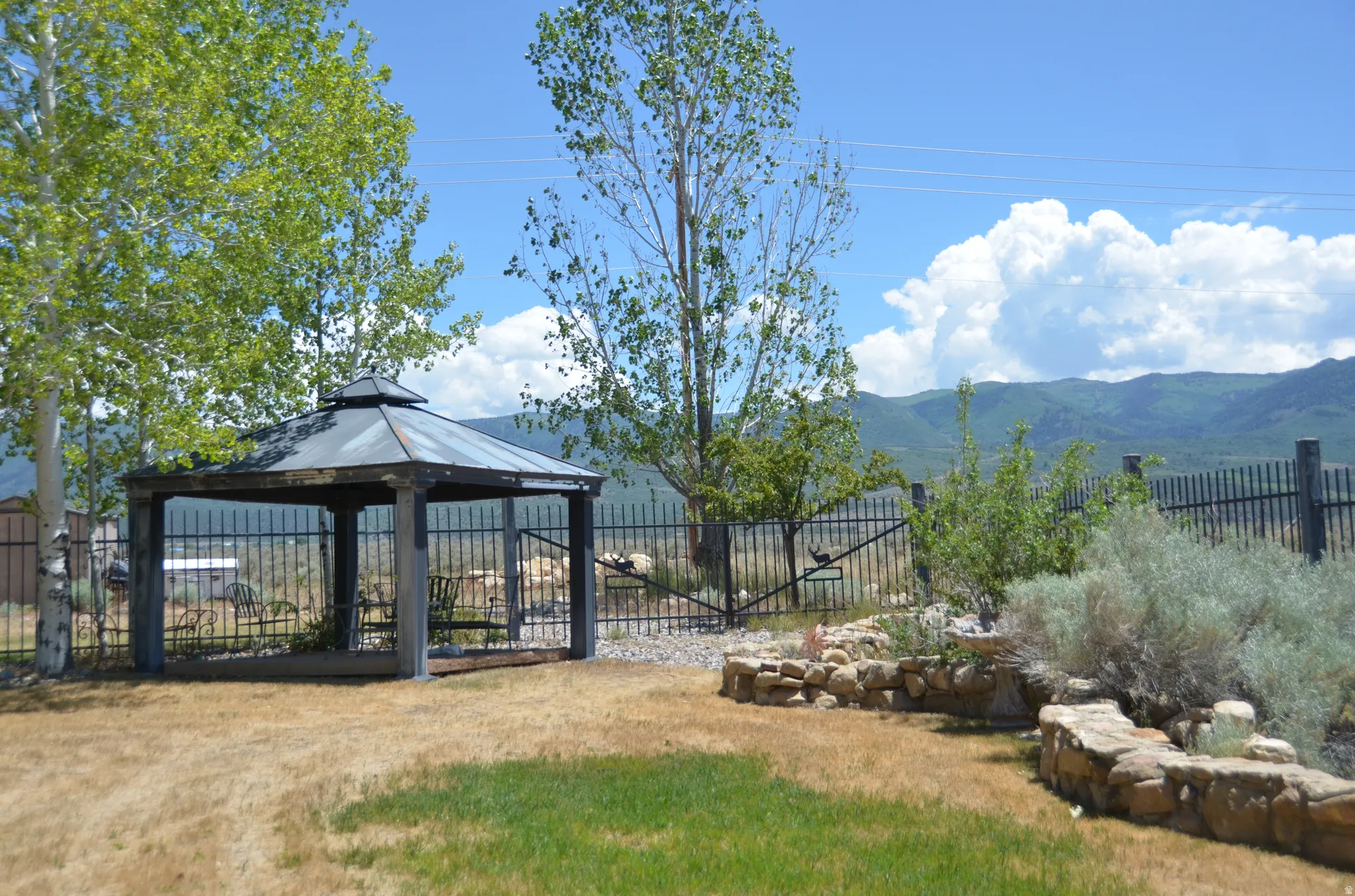 Outdoor gazebo with a tiered roof structure