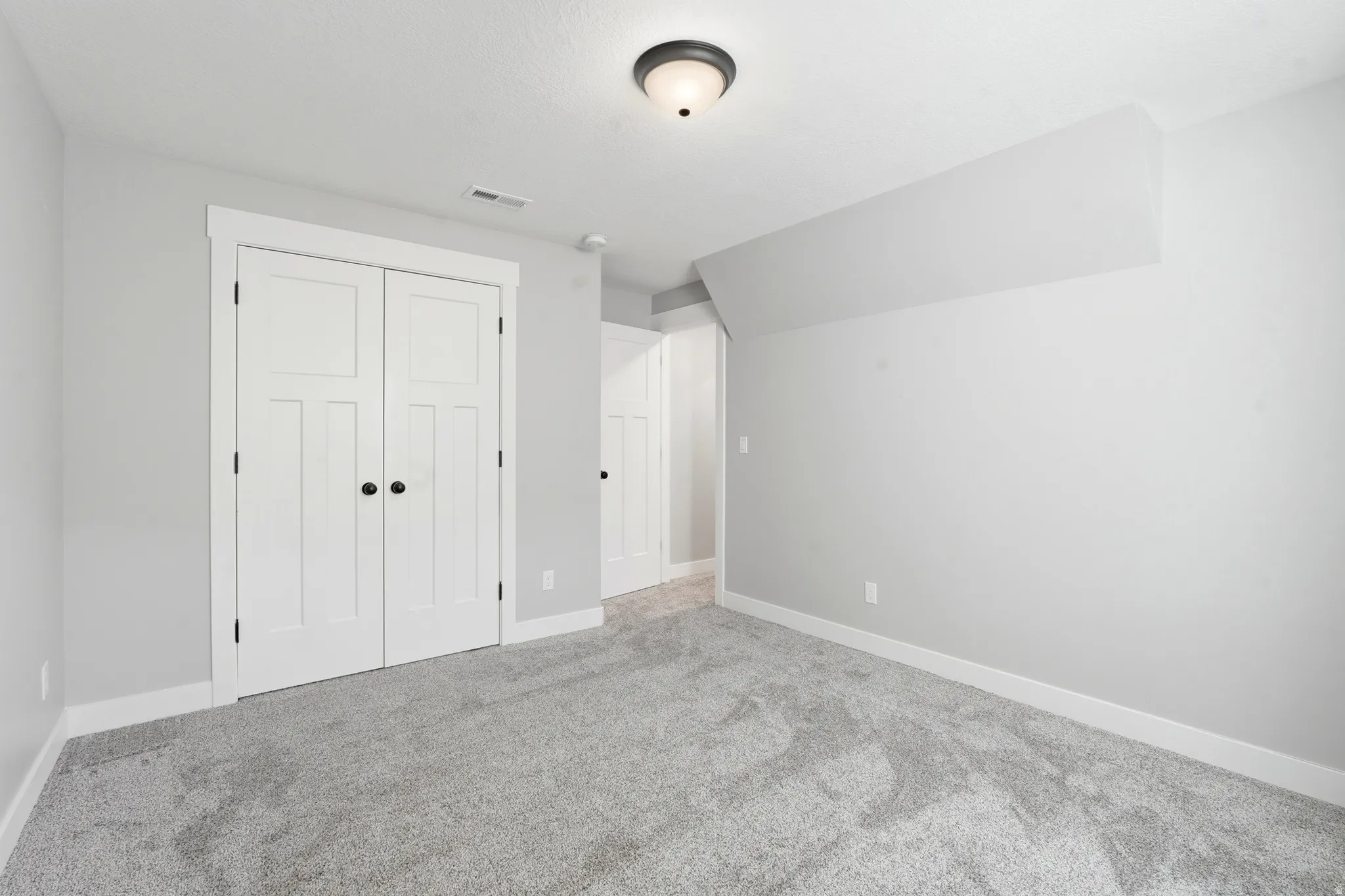 Soft gray wall paint with crisp white trim throughout