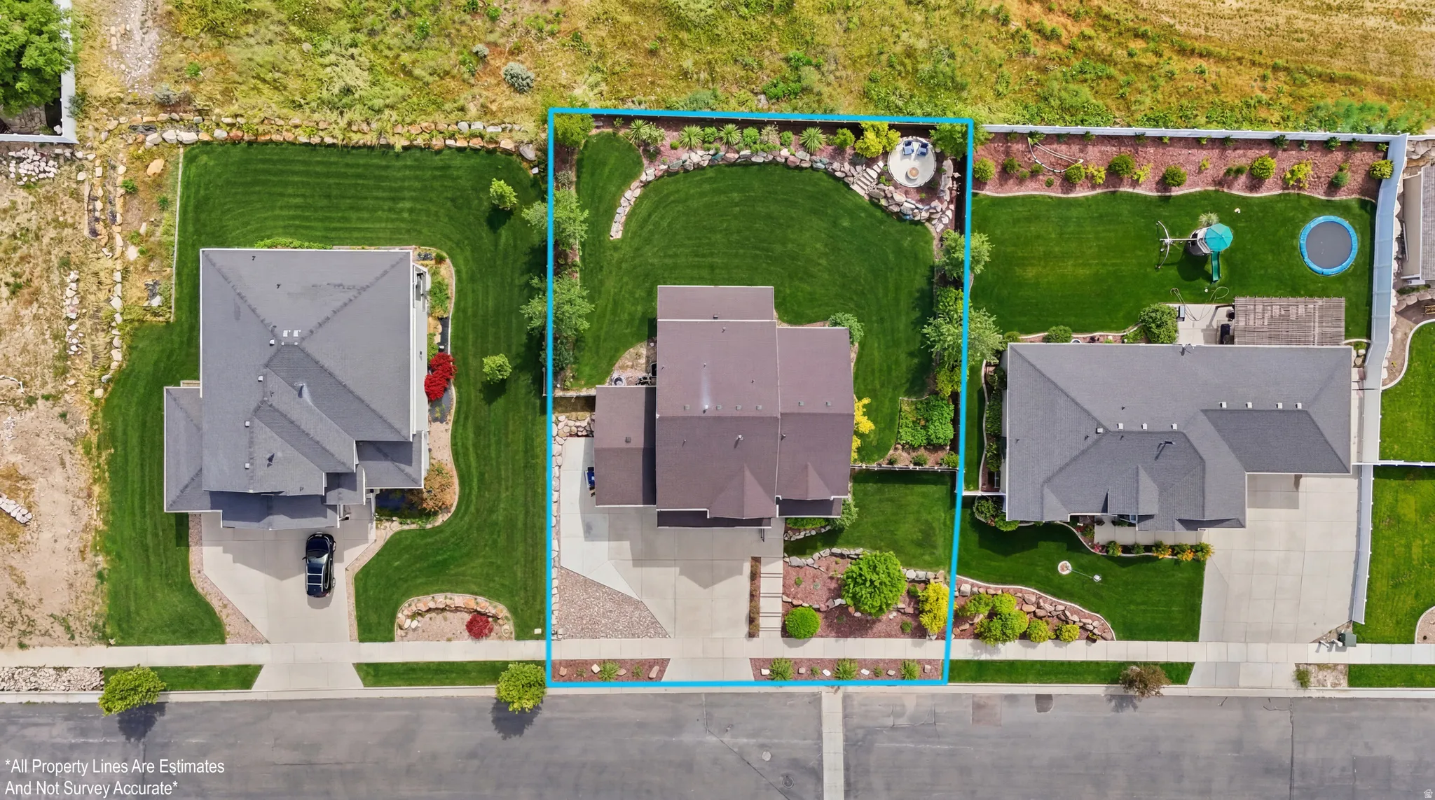 Expansive property featuring a multi-level roofline, extensive front and rear lawns, and mature landscaping