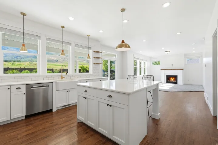 Kitchen and living area featuring wood-finish flooring